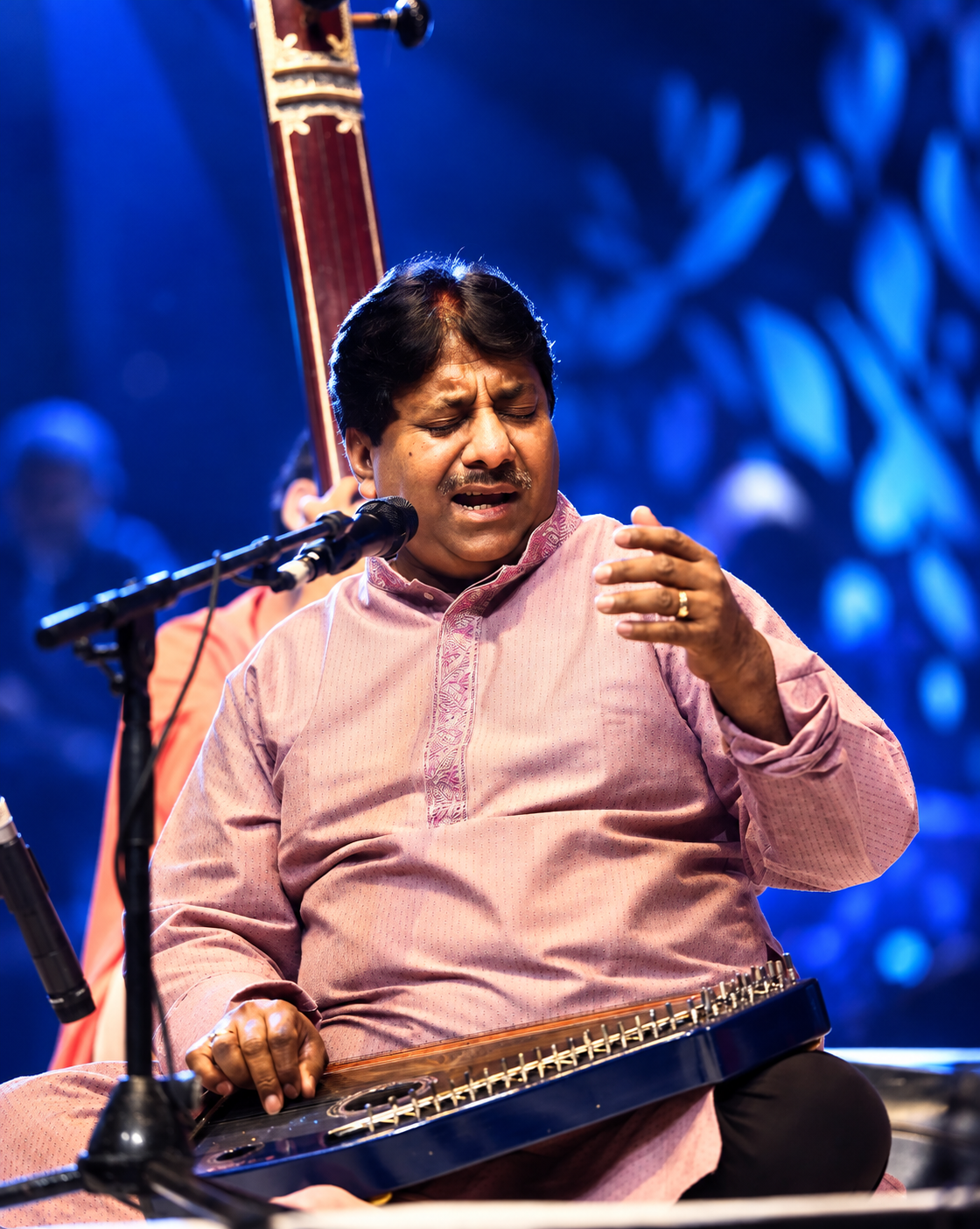 Ustad Rashid Khan performing with a string instrument